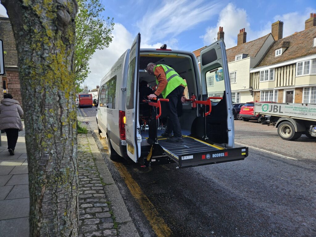 The vehicle has a wheelchair lift as seen in action here in Court Street on 5th April 2024